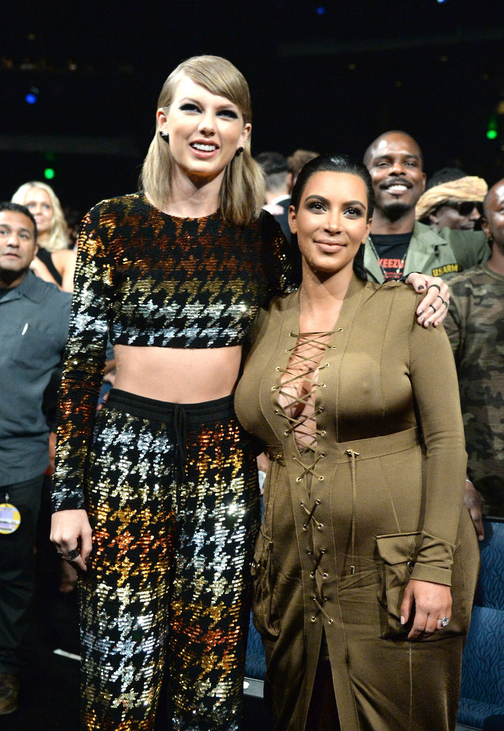 Taylor Swift and Kim Kardashian pose together pre-feud at the 2015 MTV Video Music Awards.&nbsp;