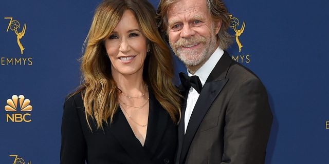 In this Sept. 17, 2018 file photo, Felicity Huffman, left, and William H. Macy arrive at the 70th Primetime Emmy Awards in Los Angeles.