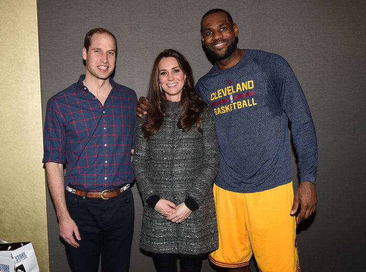 Prince William and Catherine, Duchess of Cambridge pose with LeBron James as they attend a Cleveland Cavaliers vs. Brooklyn N