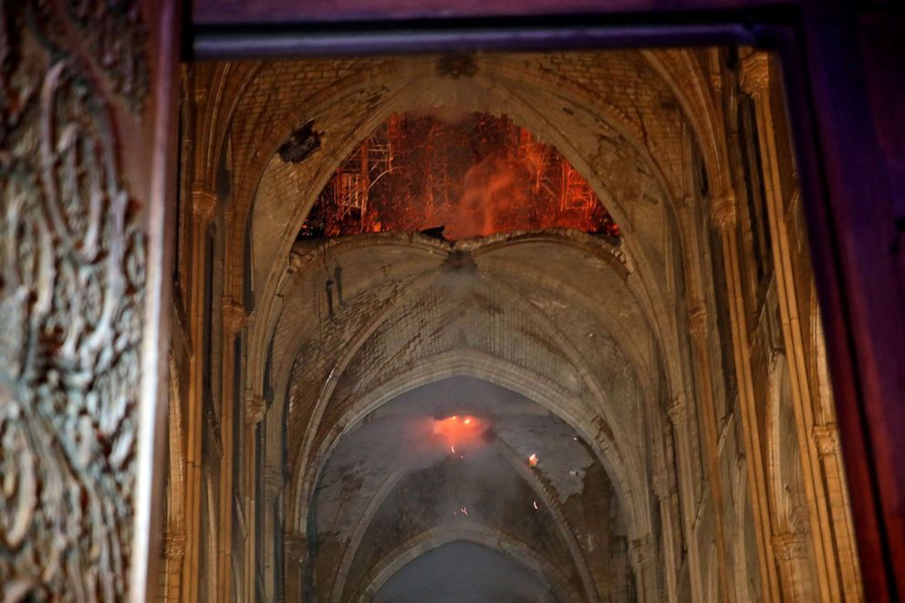 Flames and smoke are seen as the interior continues to burn inside the Notre Dame Cathedral in Paris, April 16, 2019.