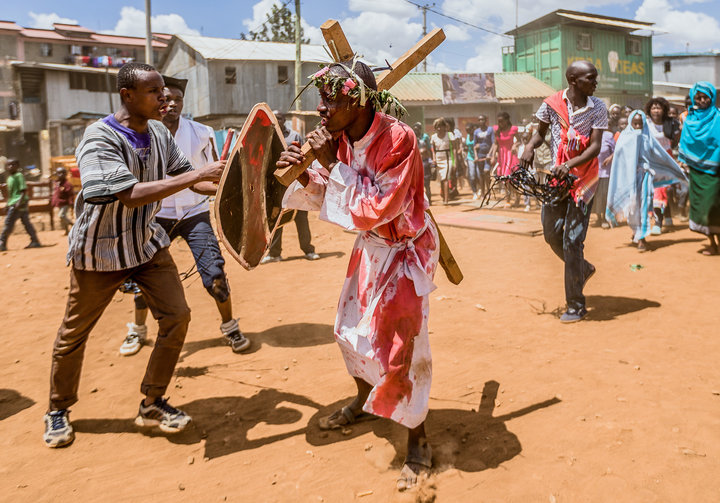 Christian devotees reenact the Way of the Cross, or Jesus Christ's passion, during a Good Friday commemoration in Kibera, Nai