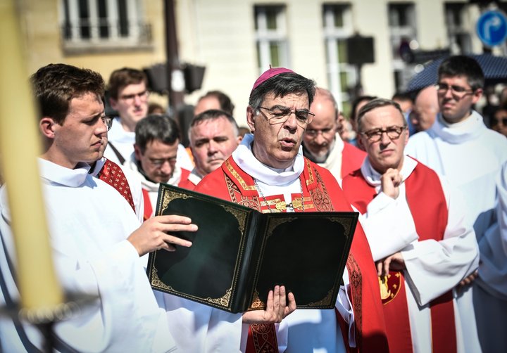 Paris Archbishop Michel Aupetit leads Holy Week celebrations near Notre Dame Cathedral on April 19, 2019, four days after a f