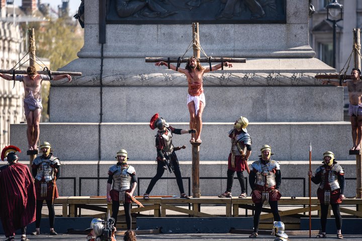 Actors reenact the crucifixion in front of crowds in Trafalgar Square on Good Friday.