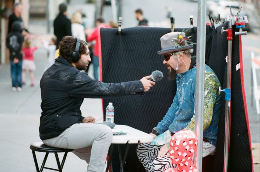 Eyal Levy Interviewing a mural subject in San Fransisco, 2018