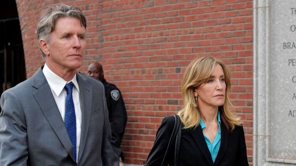 Felicity Huffman exits the John Joseph Moakley U.S. Courthouse after appearing in Federal Court to answer charges stemming from college admissions scandal, April 3, 2019,in Boston.
