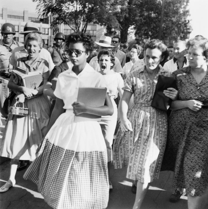 Elizabeth Eckford, one of the group of nine black students known as Little Rock Nine, walks to Little Rock's Central High wit