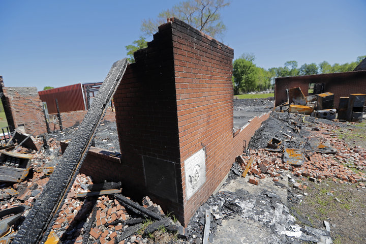 The ruins of the St. Mary Baptist Church, one of three churches that recently burned in St. Landry Parish, in Port Barre, La.