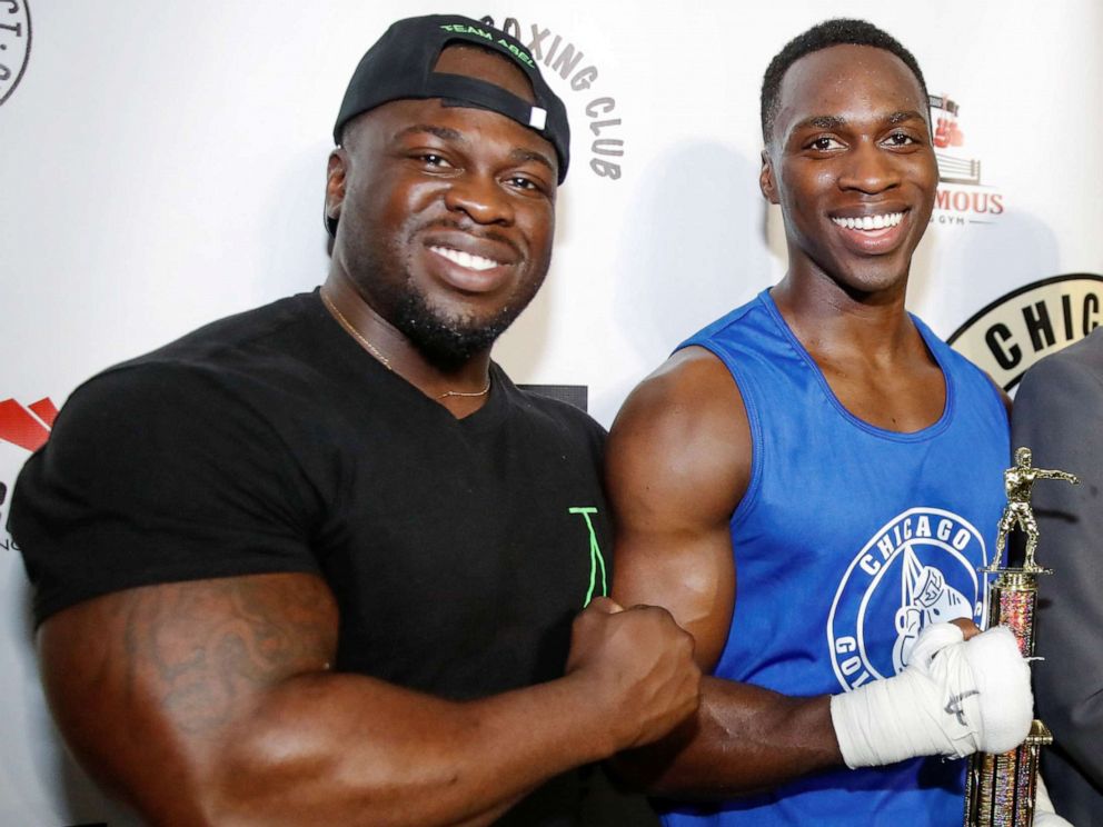 PHOTO: Abel Osundairo (left) celebrates with brother Olabinjo Osundairo after defeating John Broderick in a Golden Gloves senior novice light heavyweight division final boxing match in Chicago, April 12, 2019.