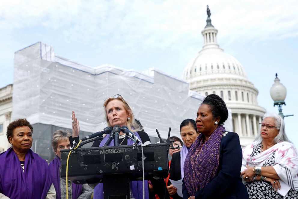 Rep. Debbie Dingell speaks as Rep. Barbara Lee and Rep. Sheila Jackson Lee, second from right, listen at a news conference after the House voted to reauthorize the Violence Against Women Act, Thursday, April 4, 2019, on Capitol Hill in Washington.