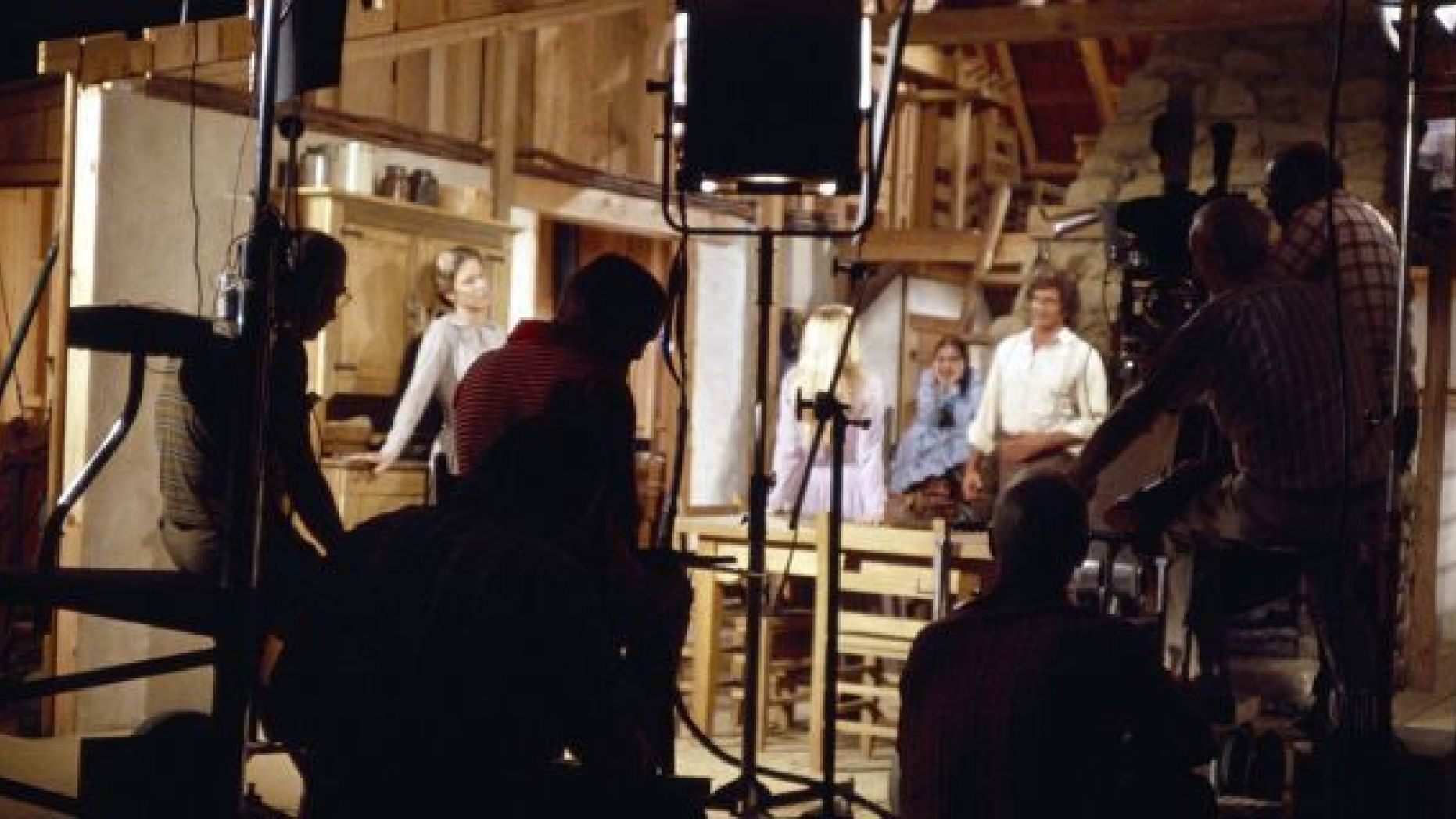 The cast and crew of "Little House on the Prairie" in a studio set. 