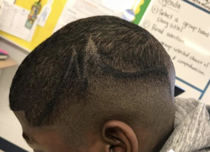 A school administrator made a junior high student cover up the "M" design in his hair with a marker.