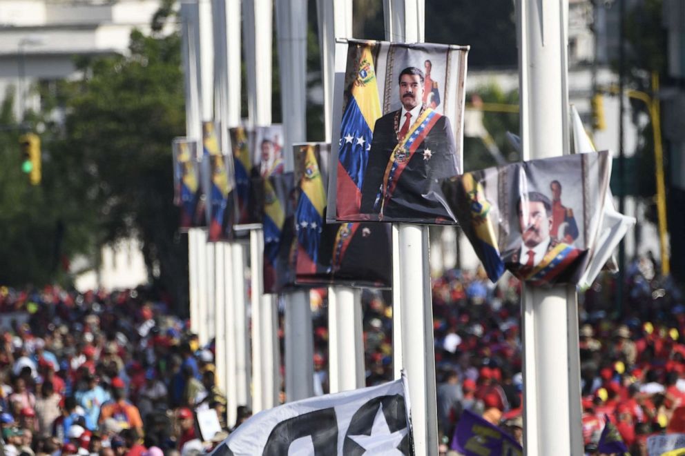 PHOTO: Posters depicting Venezuelan President Nicolas Maduro are seen during a May Day rally in Caracas on May 1, 2019.