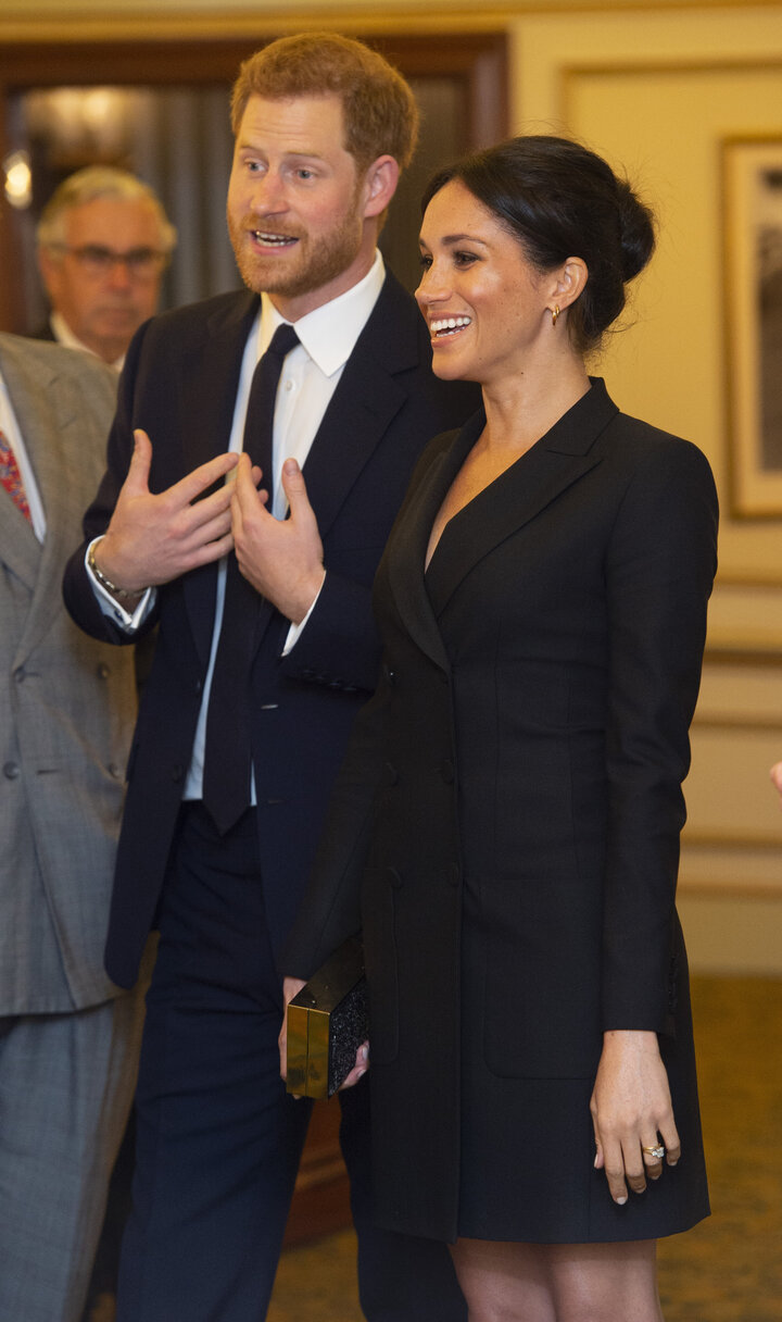 The Duke and Duchess of Sussex talk with other guests as they attend "Hamilton" in London on August 29, 2018.