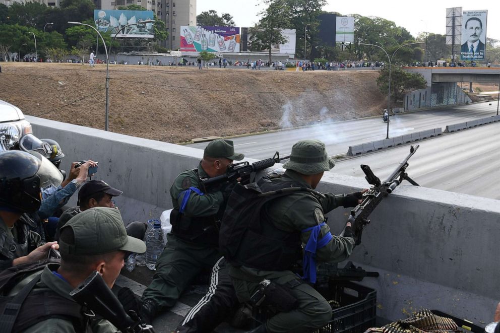 PHOTO: Soldiers loyal to Venezuelan opposition leader and self-proclaimed acting president Juan Guaido take position in front of La Carlota base in Caracas, April 29, 2019.