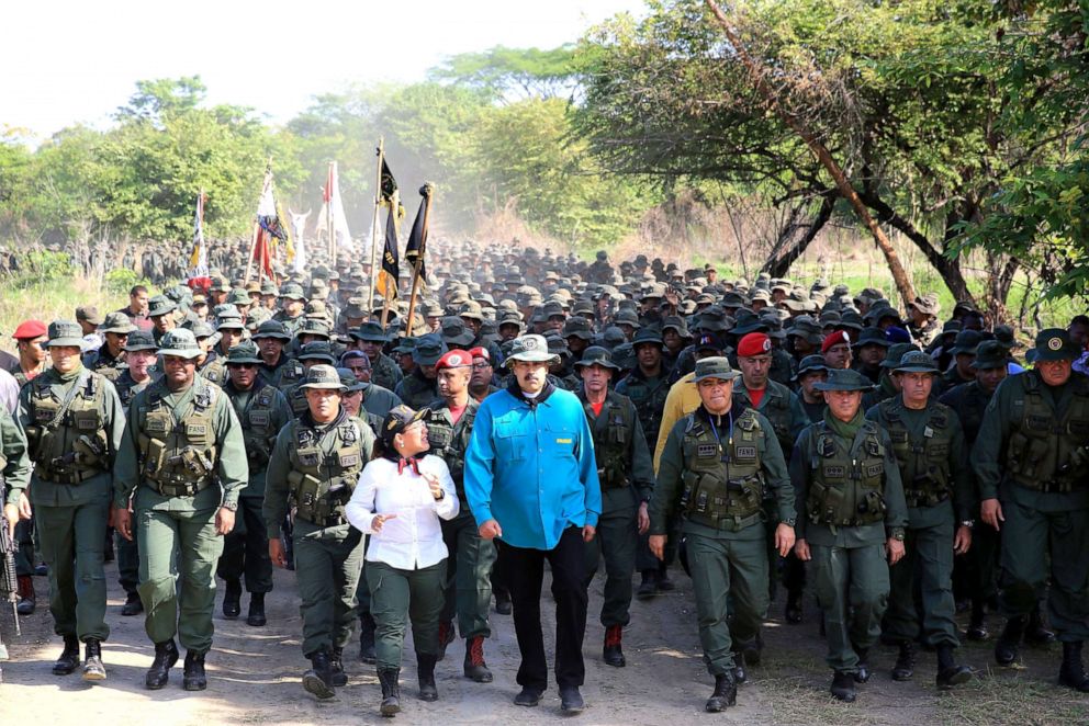 PHOTO: Handout photo released by the Venezuelan Presidency of Venezuelas President Nicolas Maduro (center) during military exercises of cadets of the Bolivarian Military University at a training center in El Pao, Cojedes state, Venezuela, May 4, 2019.