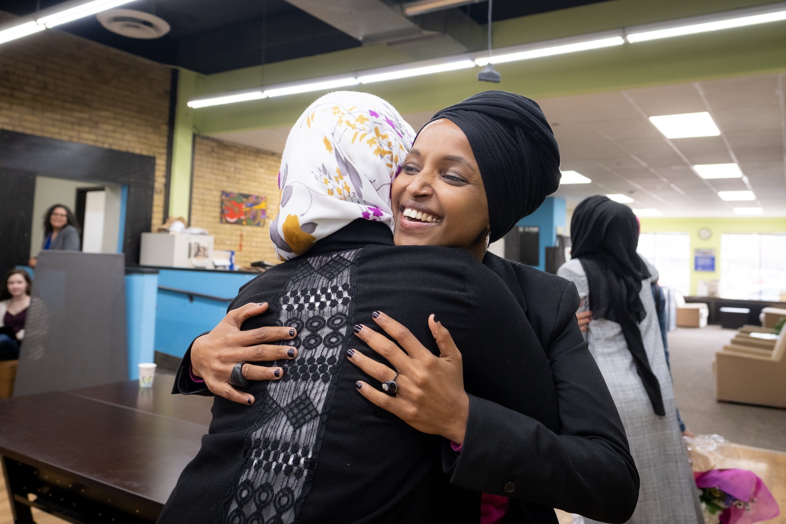 Representative Ilhan Omar greets community members at the RISE (Reviving Sisterhood) office in North Minneapolis on April 24,
