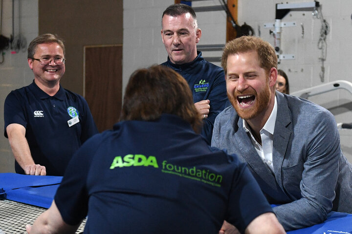 Prince Harry interacts with a participant of the Rebound Therapy session as he visits the Oxsrad Disability Sports and Leisur