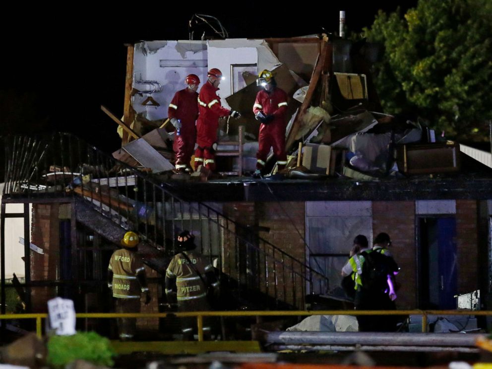 PHOTO: Emergency workers check what is left of the second floor of a hotel, May 26, 2019, in El Reno, Okla., following a tornado.
