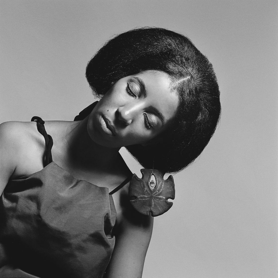 Carolee Prince,&nbsp;African Jazz-Art Society &amp; Studios (AJASS), Harlem, circa 1964, wearing her own jewelry designs. Prince created much of the jewelry and headpieces featured in Brathwaite&rsquo;s work. From "Kwame Brathwaite: Black Is Beautiful" (Aperture, 2019).