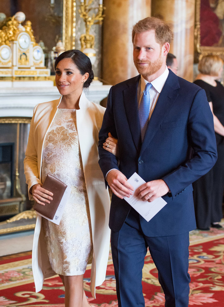 Meghan, Duchess of Sussex and Prince Harry attend a reception to mark the 50th anniversary of the investiture of the Prince o