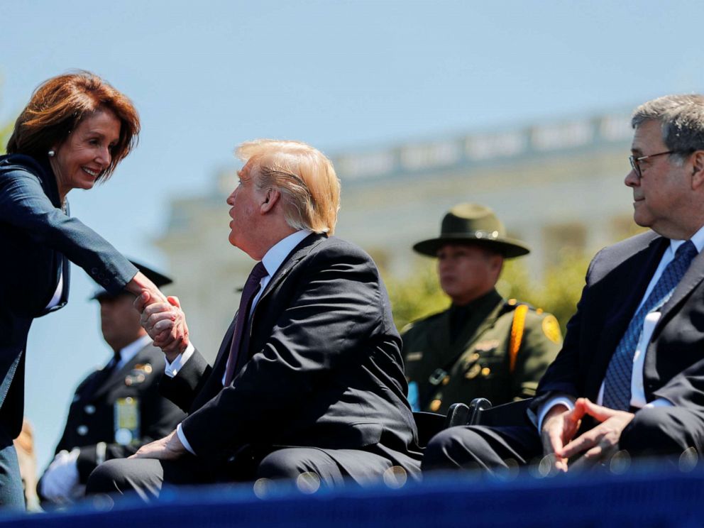 PHOTO: President Donald Trump shakes hands with Speaker of the House Nancy Pelosi while Attorney General William Barr looks on as they all attend the 38th Annual National Peace Officers Memorial Service on Capitol Hill, May 15, 2019. 