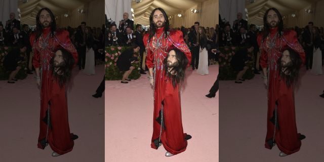 Jared Leto, holding a model of his own head, attends the 2019 Met Gala in New York City.