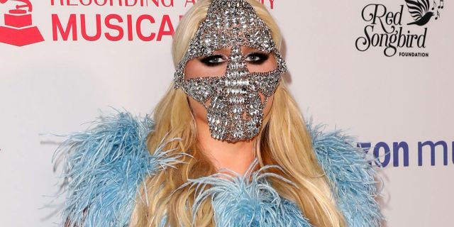 Kesha attended the MusiCares Concert for Recovery on Thursday night wearing a blue sequined gown by designer Cheng-Huai Chuang, with a crystal mask and silver glove for accessories. (Photo by Paul Archuleta/FilmMagic)