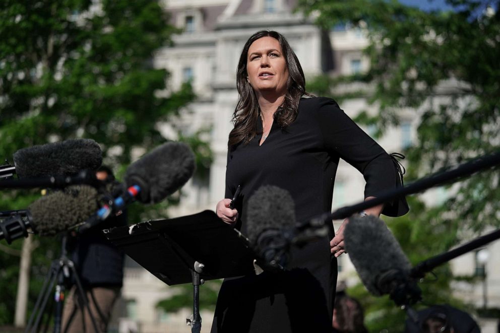 PHOTO: White House Press Secretary Sarah Sanders talks to reporters outside the White House, April 29, 2019 in Washington.