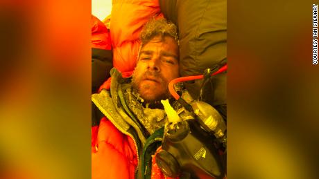 Ian Stewart covered in icicles and snow collapses in his tent after summiting Everest.