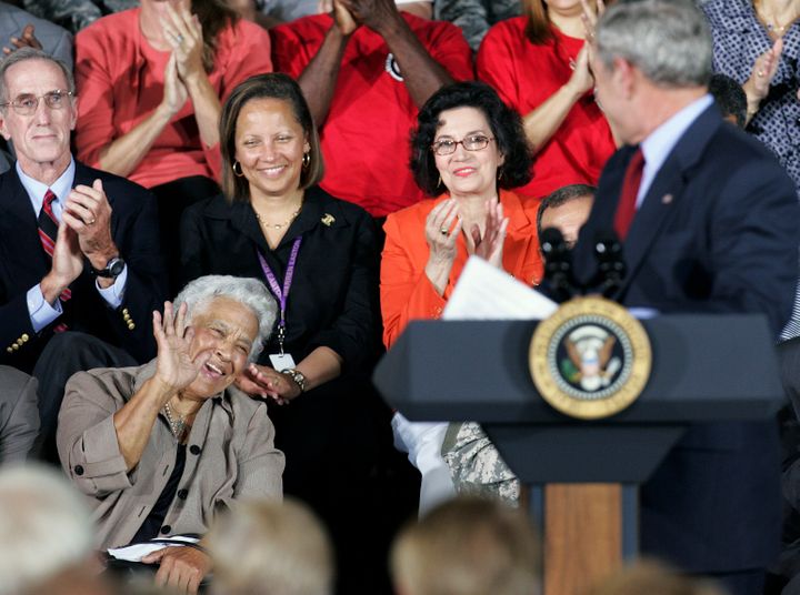 New Orleans chef Leah Chase waves to President Bush as the president acknowledges her during a speech at Jackson Barracks, wh
