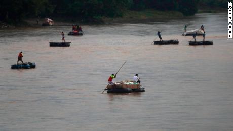 Rafts criss-cross the Suchiate river on the Guatemala -- Mexico border, near Ciudad Hidalgo, Mexico, on May 31, 2019. 