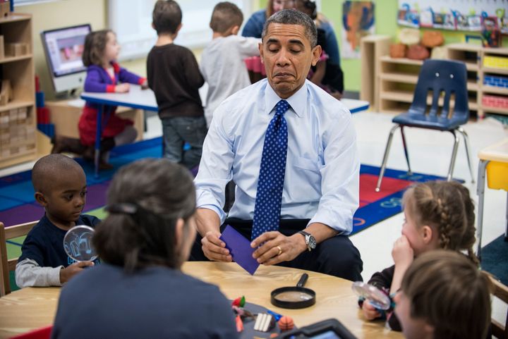 Obama plays a learning game while visiting children at College Heights Early Childhood Learning Center in Decatur, Georgia, in February 2012.