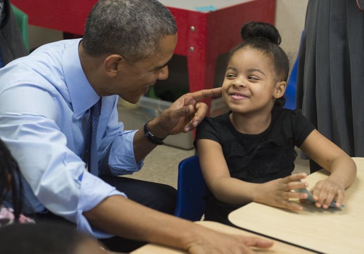 Obama talks with Akira Cooper during a visit to a classroom at the Community Children's Center in Lawrence, Kansas, in January 2015.