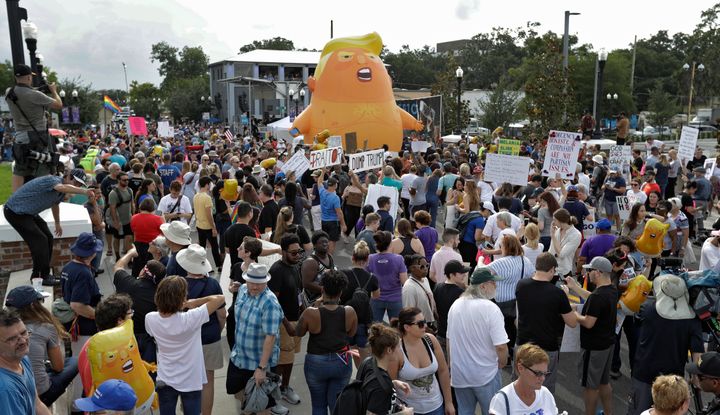An inflatable Baby Trump balloon towered over protesters during a rally Tuesday, June 18, in Orlando, Florida. A large group 
