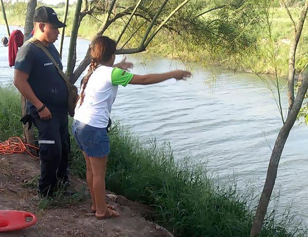 PHOTO: Tania Vanessa Avalos of El Salvador speaks with Mexican authorities, June 23, 2019, after her husband and nearly two-year-old daughter were swept away by the current in Matamoros, Mexico, while trying to cross the Rio Grande to Brownsville, Texas.