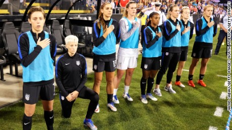 Megan Rapinoe of the US  Women&#39;s team kneels during the playing of the national anthem. 