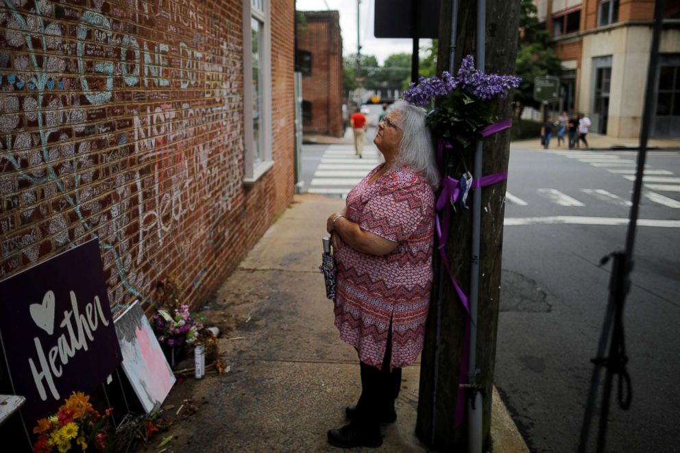 PHOTO: Susan Bro, mother of Heather Heyer, who was killed during the August 2017 white nationalist rally in Charlottesville, stands at the memorial at the site where her daughter was killed in Charlottesville, Va., July 31, 2018.