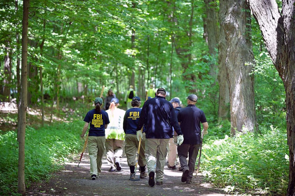 PHOTO: The FBI and police search the woods inside Wavenly Park for the remains of Jennifer Dulos, in New Canaan, Conn., June 3, 2019.