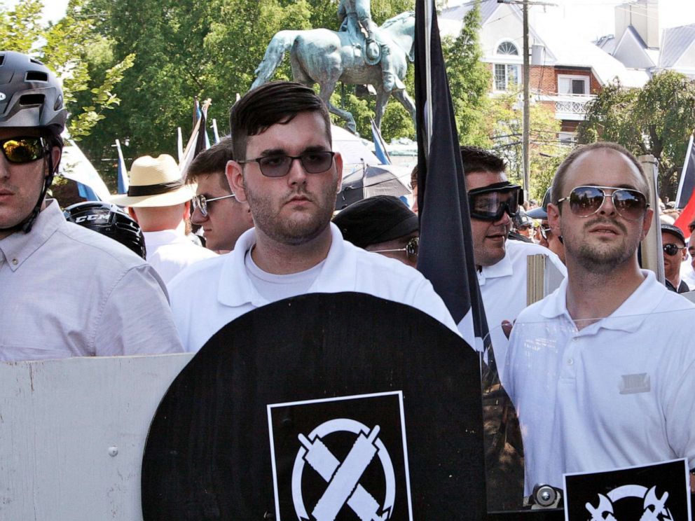 PHOTO: In this Aug. 12, 2017 photo, James Alex Fields Jr., second from left, holds a black shield in Charlottesville, Va., where a white supremacist rally took place. 