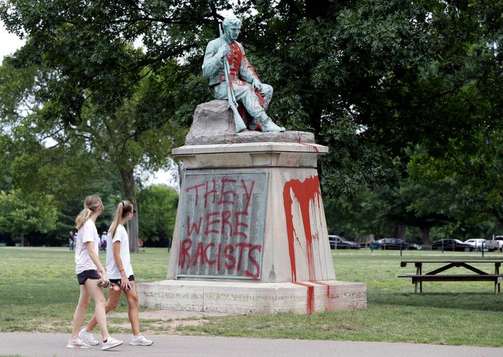 People walk past a monument to Confederate soldiers in Centennial Park in Nashville, Tennessee, on Monday.