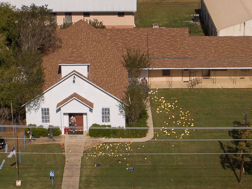 PHOTO: Flags mark evidence on the lawn of the First Baptist Church in Sutherland Springs, Texas, Nov. 6, 2017, a day after the mass shooting. 