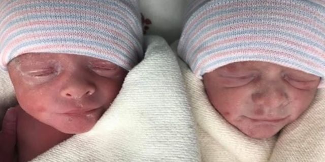 The twins, pictured above, are still hospitalized, according to the family.