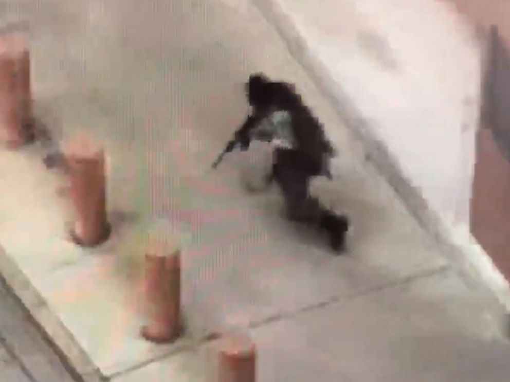 PHOTO: Cell-phone video taken by a witness appears to show a gunman dressed in tactical gear firing an assault rifle outside the Earle Cabell federal courthouse in Dallas on June 17, 2019.