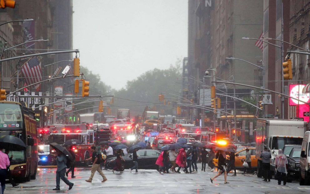 PHOTO: Emergency vehicles fill the street at the scene after a helicopter crashed atop a building in Times Square and caused a fire in the Manhattan borough of New York, June 11, 2019. 