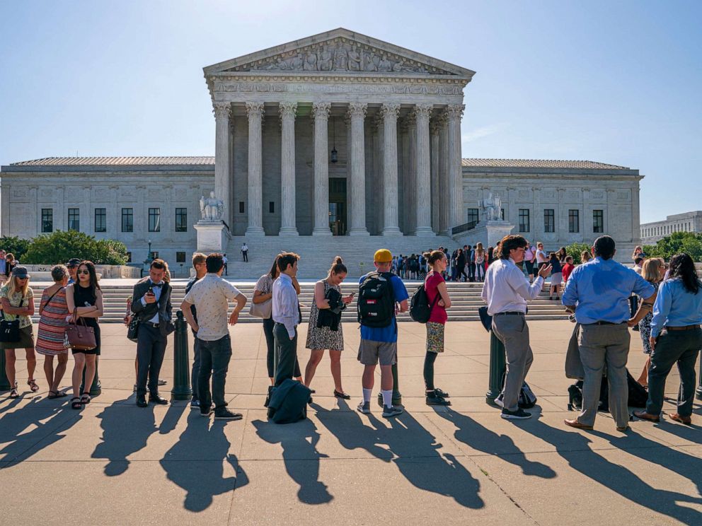 PHOTO: Visitors line up to enter the Supreme Court on Capitol Hill in Washington, June 24, 2019.