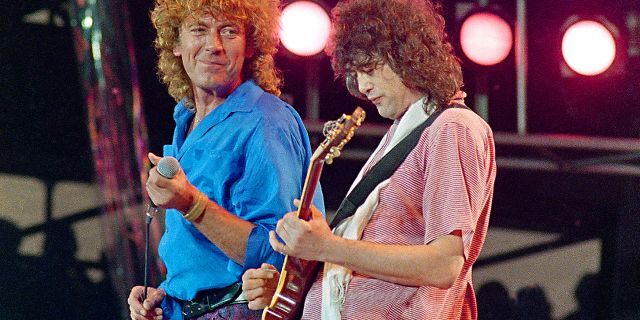 In this July 13, 1985 file photo, Led Zeppelin bandmates, singer Robert Plant, left, and guitarist Jimmy Page, reunite to perform for the Live Aid famine relief concert at JFK Stadium in Philadelphia.