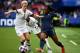 United States' forward Megan Rapinoe (L) fights for the ball with France's forward Kadidiatou Diani during the France 2019 Women's World Cup quarter-final football match between France and United States, on June 28, 2019, at the Parc des Princes stadium in Paris. (Photo by FRANCK FIFE / AFP)        (Photo credit should read FRANCK FIFE/AFP/Getty Images)