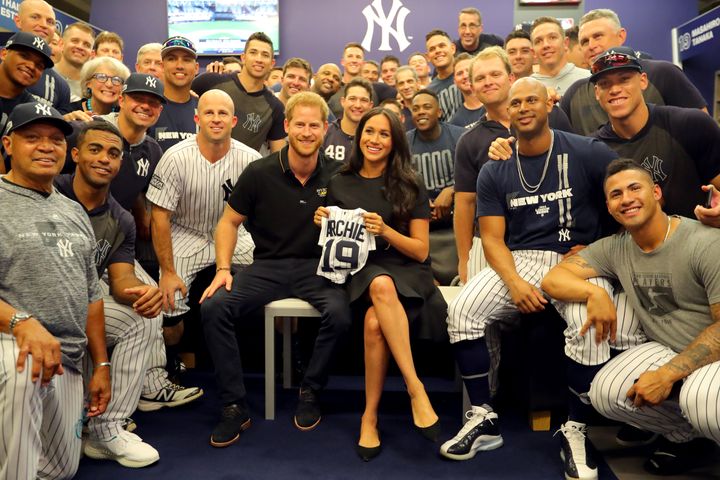 The Duke and Duchess of Sussex pose for a photo with the New York Yankees in the clubhouse prior to the first game of the Lon