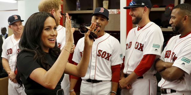 Britain's Prince Harry and Meghan, Duchess of Sussex meet Boston Red Sox players before a match against the New York Yankees in London.