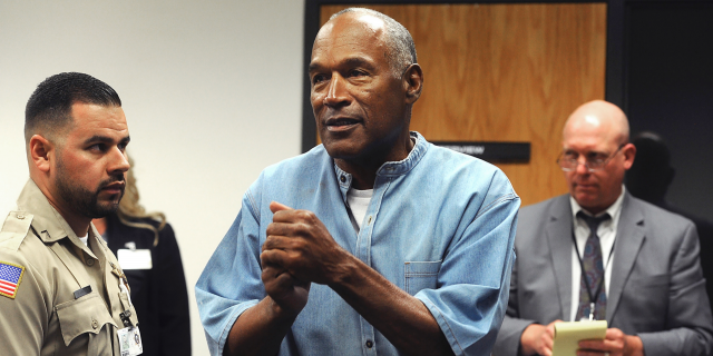 Former NFL football star O.J. Simpson reacts after learning he was granted parole at Lovelock Correctional Center in Lovelock, Nev. 